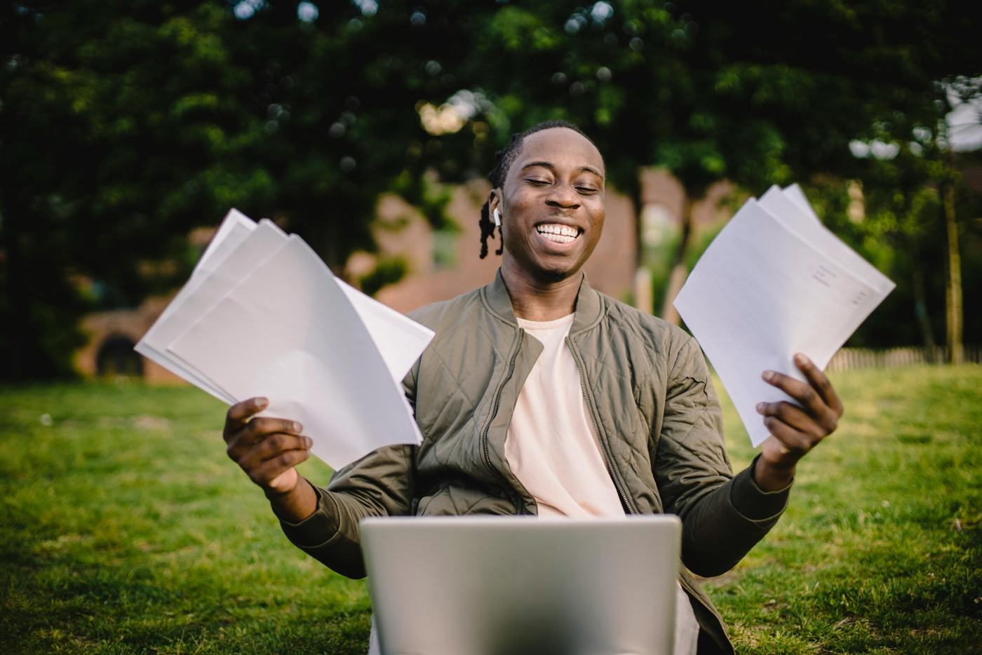 A student celebrating with his acceptance letter